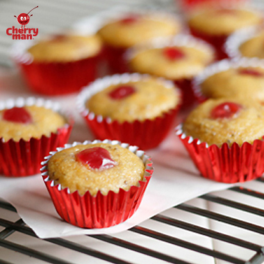 Bitesized cherry chia mini muffins in mini red cupcake liners.