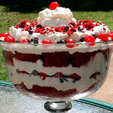 Cherry red velvet trifle with layers of cake and whipping cream