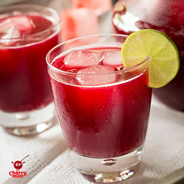 Holiday punch beverage setting with cherry ice cubes